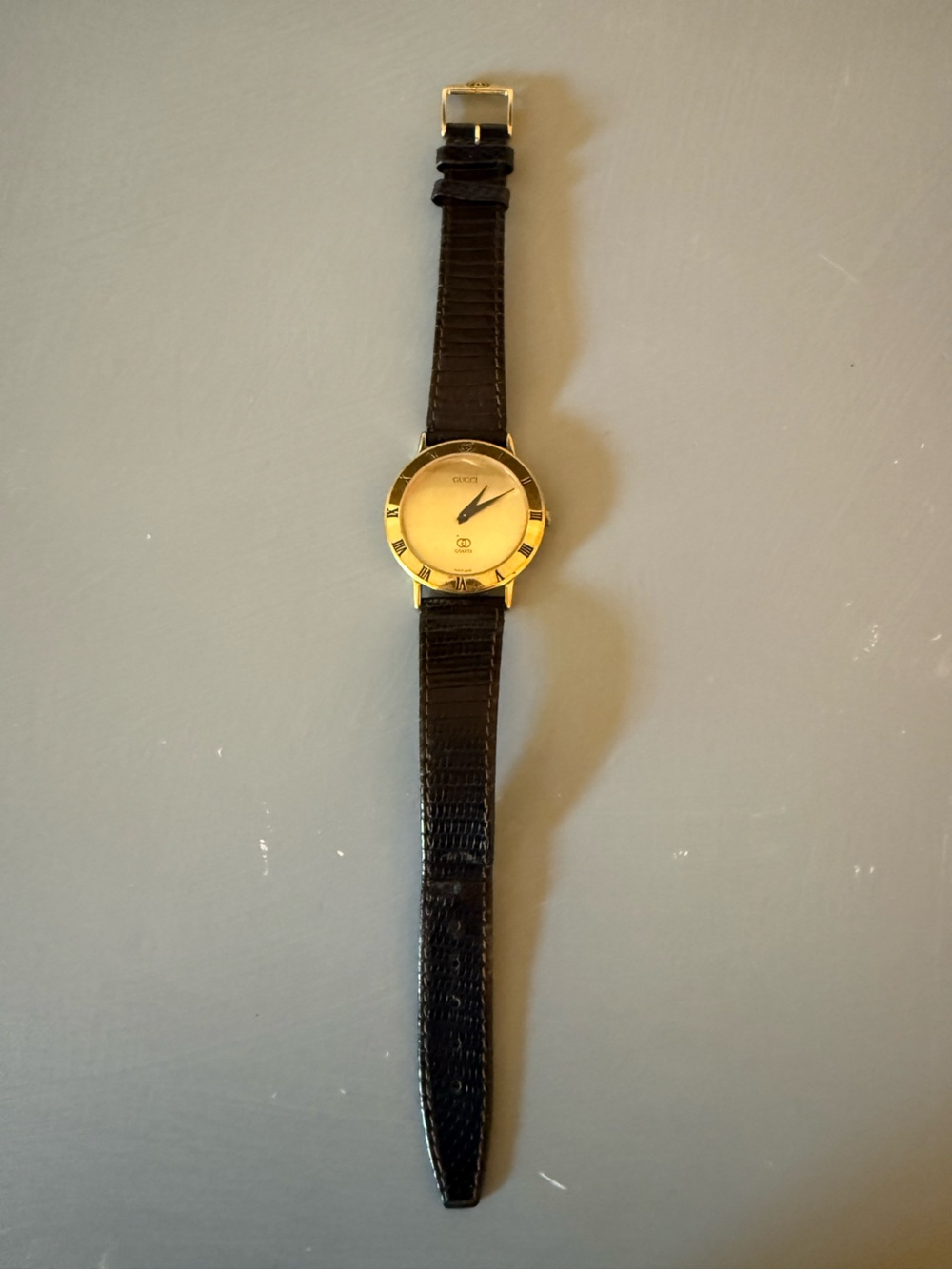 Gucci Classic Men's Gold-Tone Watch with Black Leather Strap